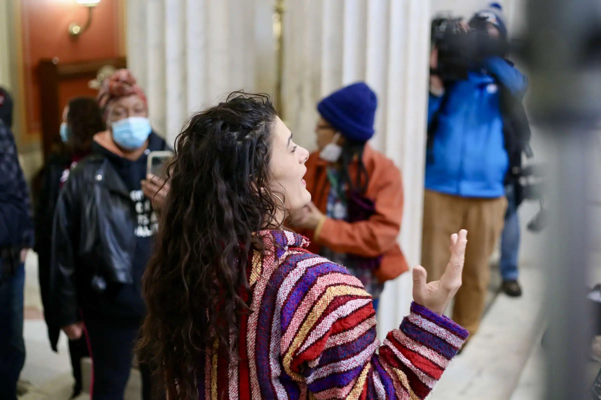 Protester at a rally against Rhode Island Governor Daniel McKee, opposing his plan to evict a homeless encampment