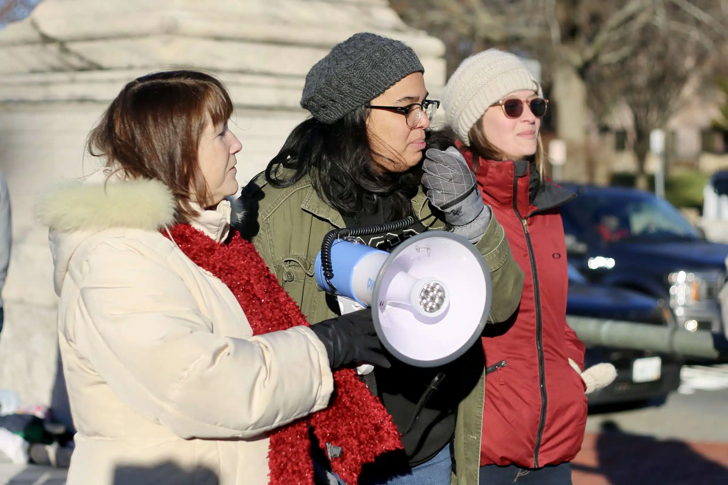 Protesters at a rally against Rhode Island Governor Daniel McKee, opposing his plan to evict a homeless encampment