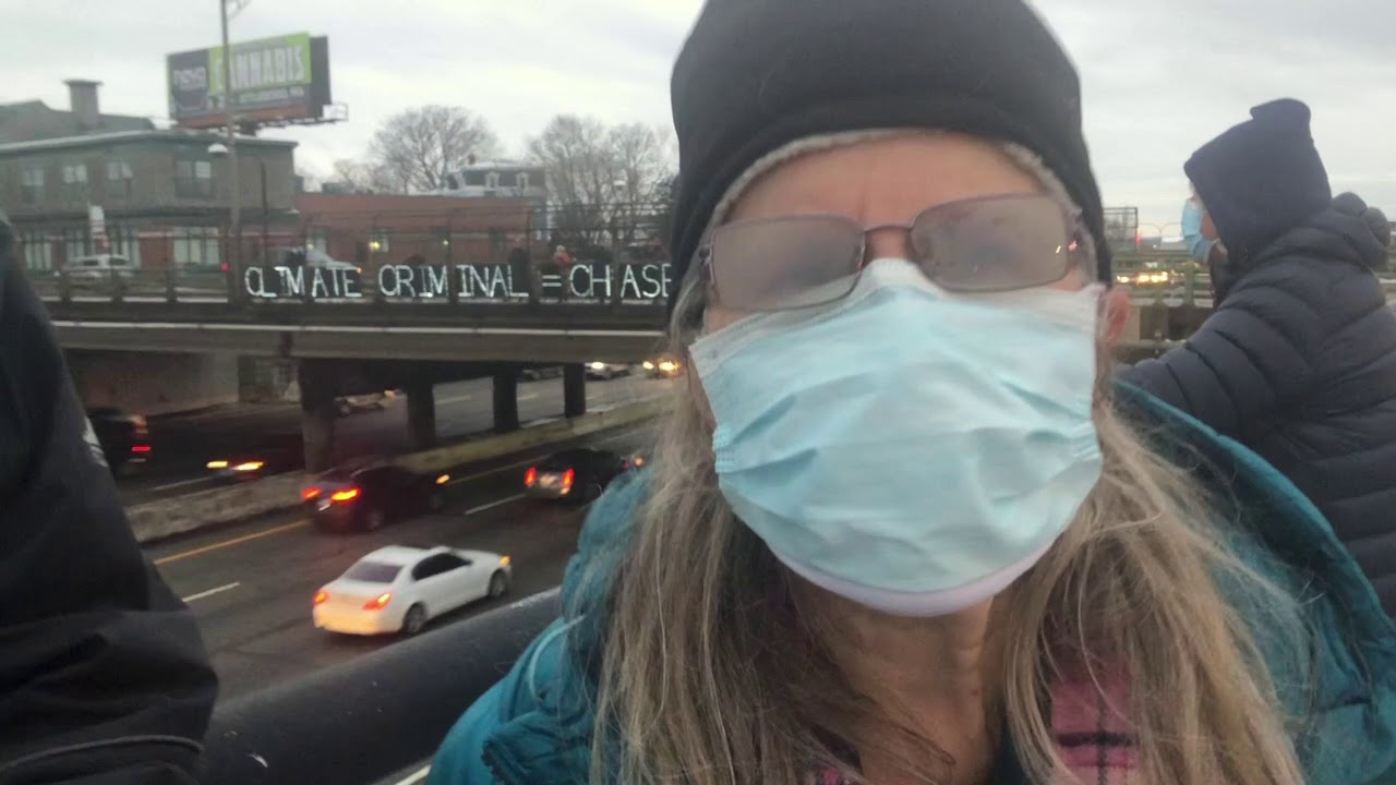 Climate Action Rhode Island Puts Up Highway Sign Saying "CLIMATE CRIMINAL = CHASE BANK"