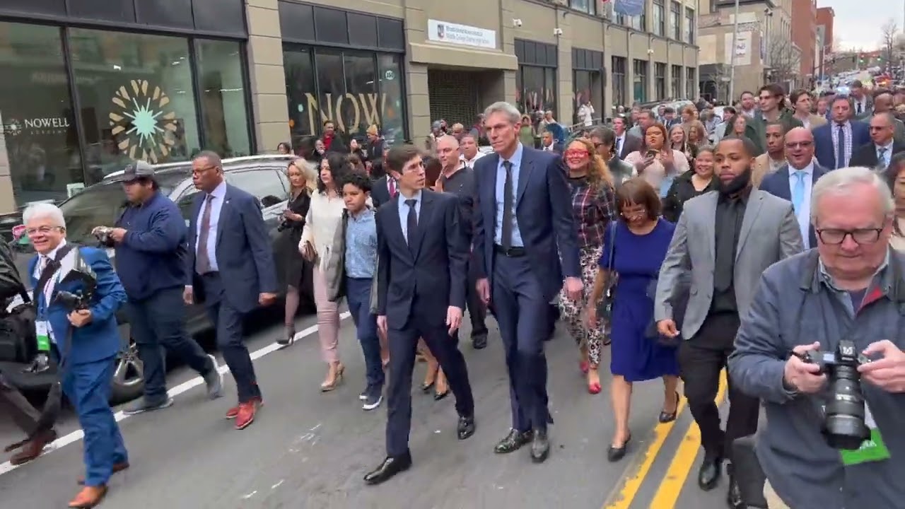 Providence Mayor Brett Smiley marches from his inauguration at PPL to the PVD City Hall