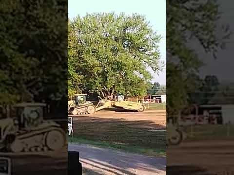 Several Construction Vehicles Grading Land Near Janie's Home