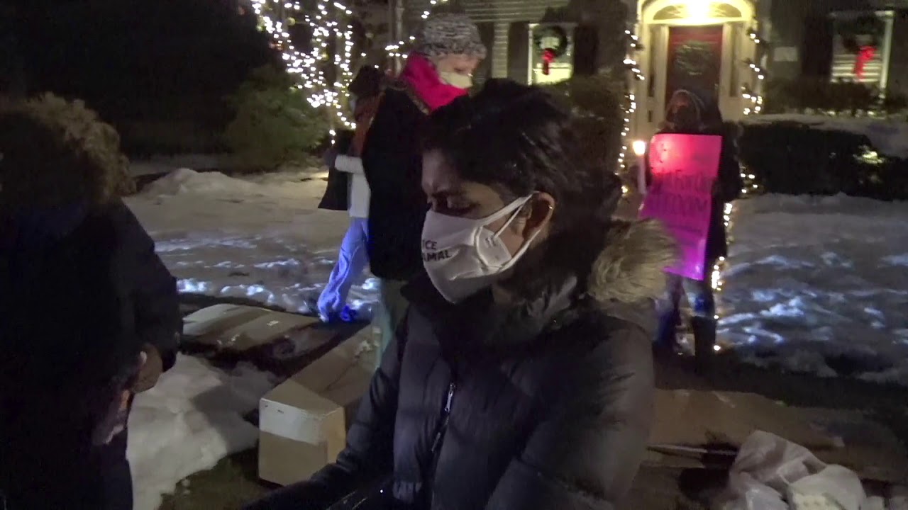 People Lay Flowers on Coffin Outside RI Governor's House