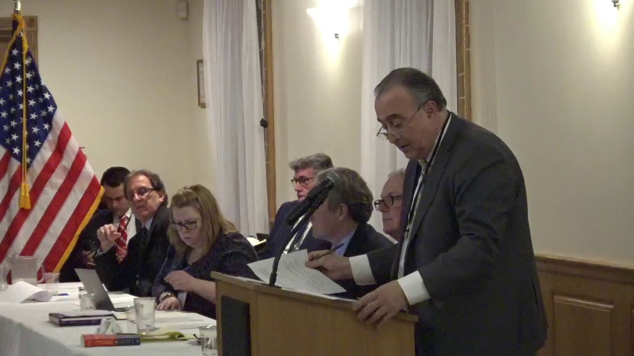At the RI Dem Party meeting, Secretary Arthur Corvese calls the roll