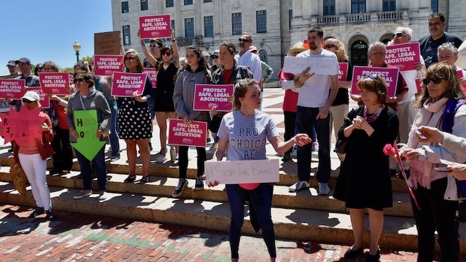 Photo for Nearly 100 people hold noon time, pro-choice protest at Rhode Island State House