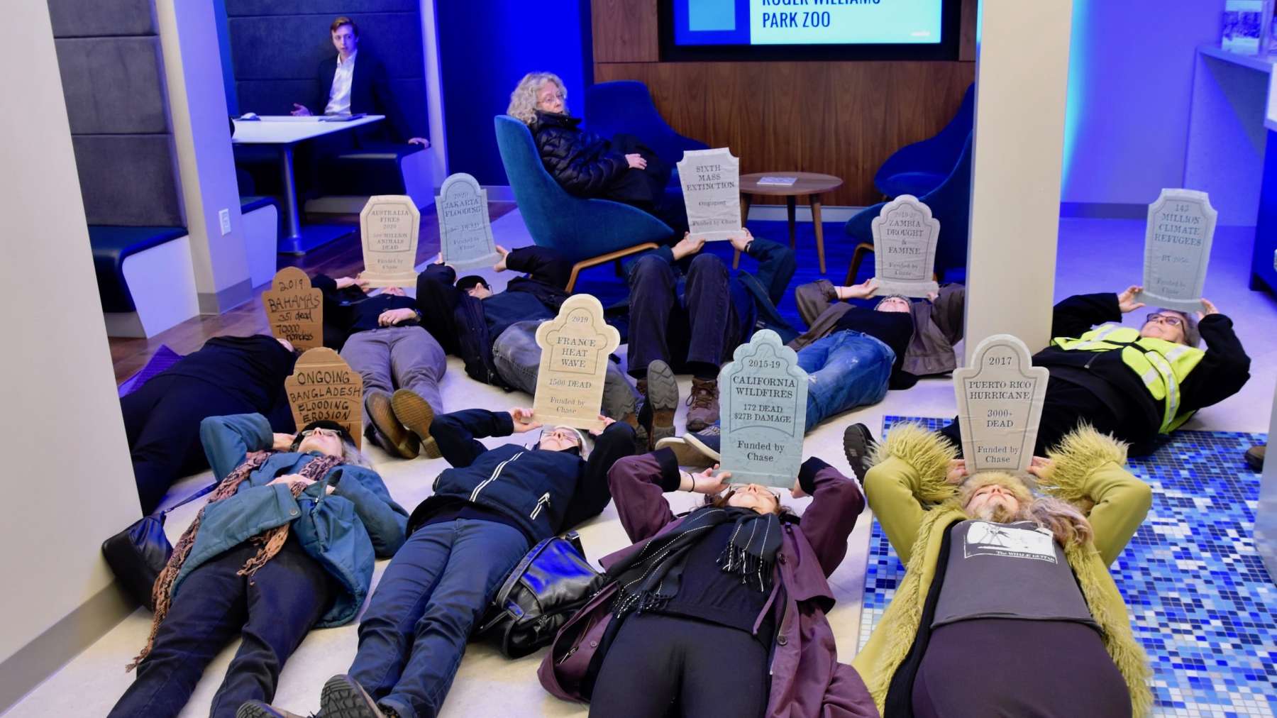 Protesters stage a die-in at Chase Bank, the leading funder of climate change