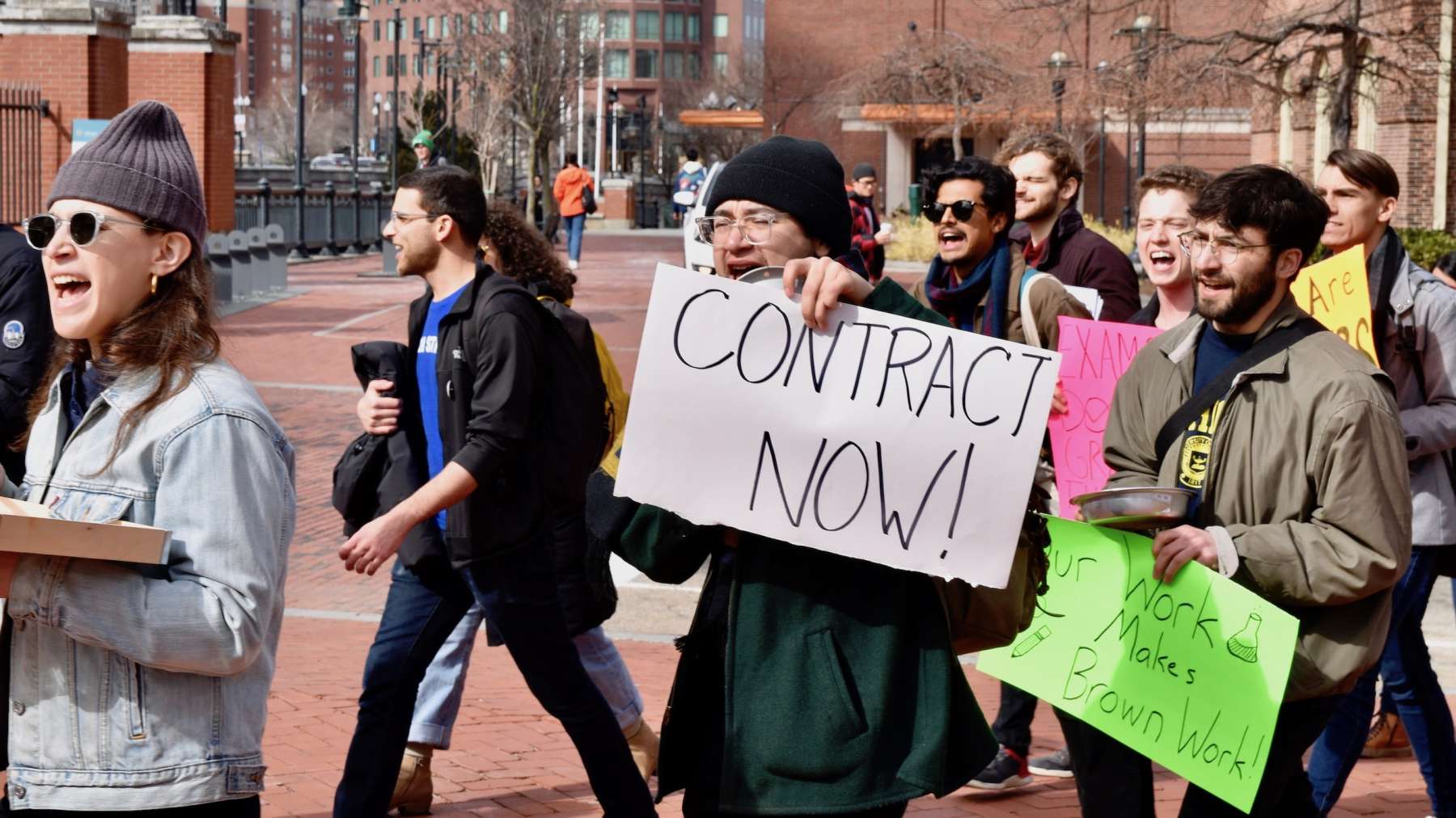 Graduate students march to pressure Brown University to final agreement on contact