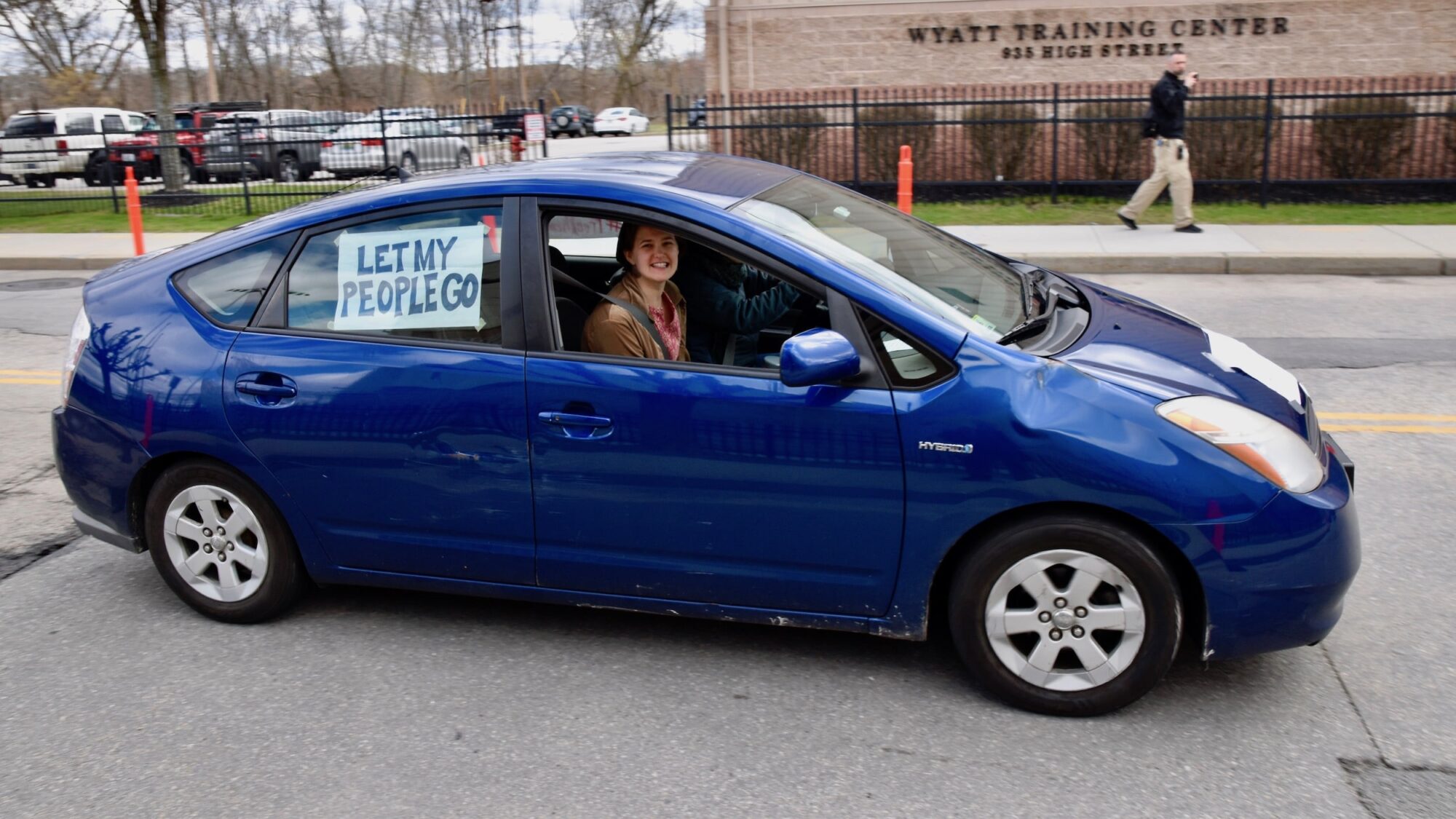 Rhode Island News: Never Again Action protests ICE detention amid COVID-19 at the Wyatt – from their cars