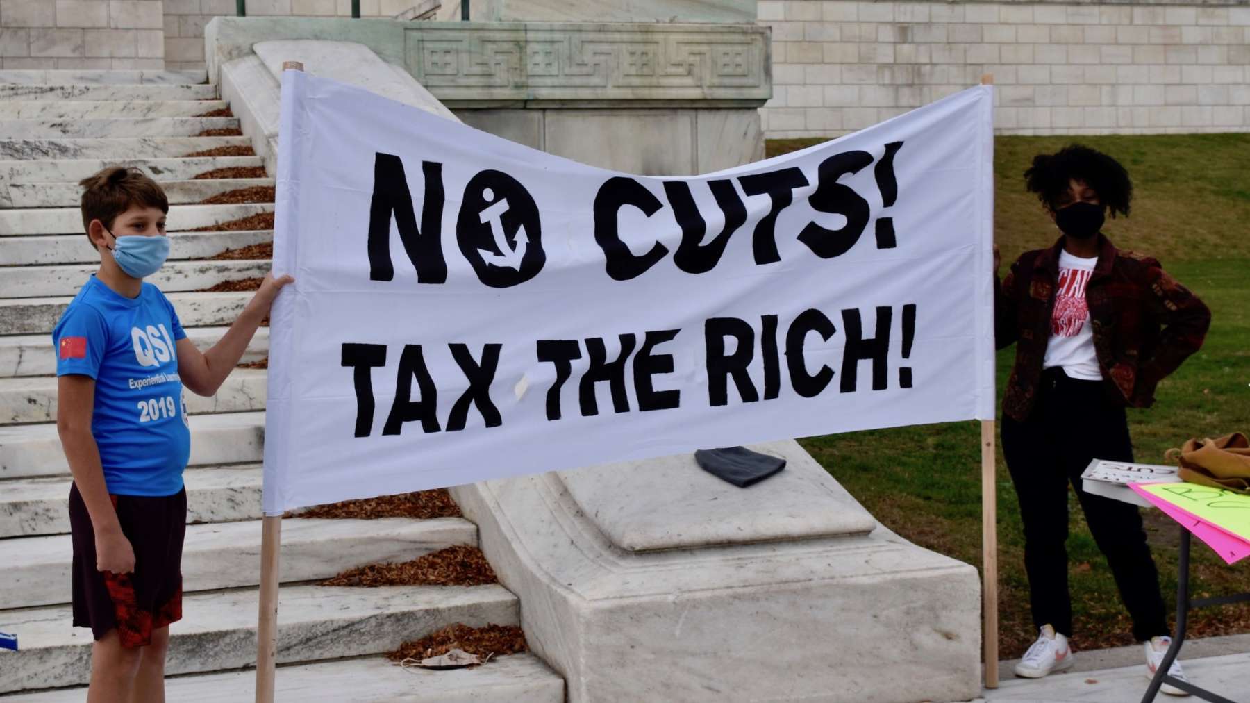 Coalition rallies for taxes on rich to fund essential services
