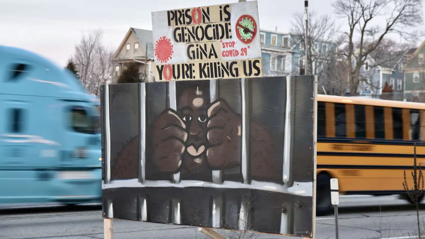 Highway signs reading “Prison is Genocide” and “Gina You’re Killing Us” placed over night