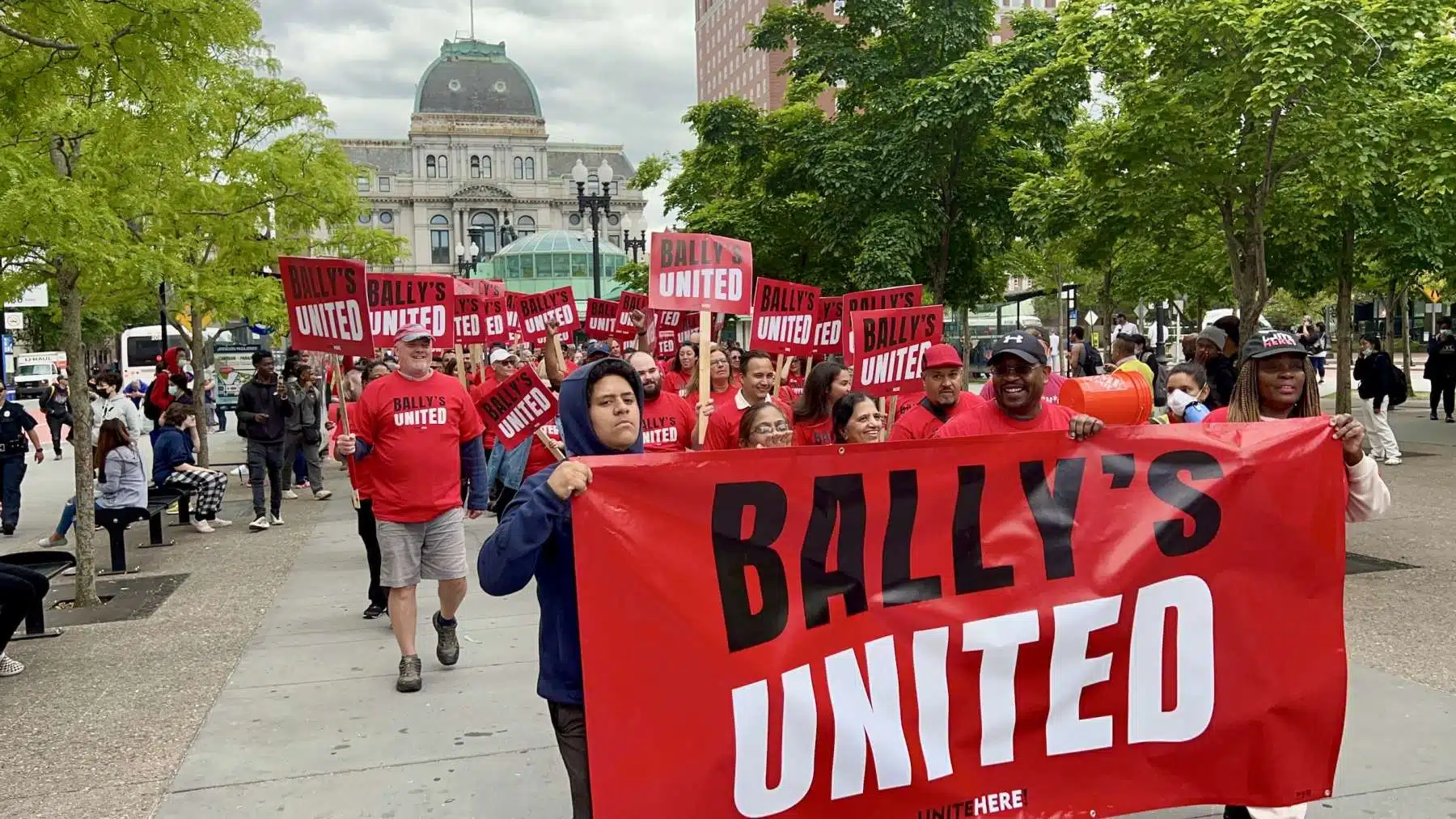 Casino workers rally and march to Bally’s HQ in Providence to demand full staffing and substantial raises