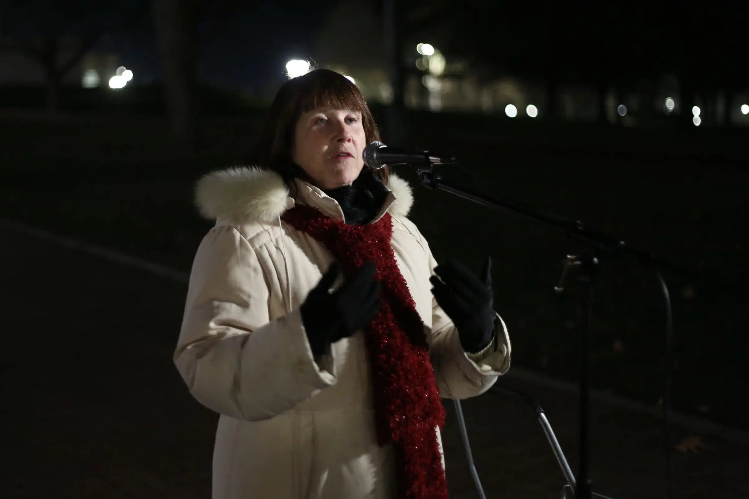 Pamela Poniatowski speaking at a protest calling on Rhode Island Governor Daniel McKee to do something about homelessness.