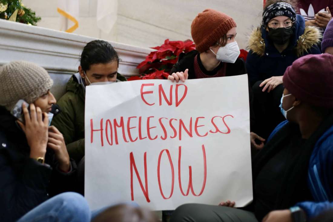 Protesters at a rally against Rhode Island Governor Daniel McKee, opposing his plan to evict a homeless encampment